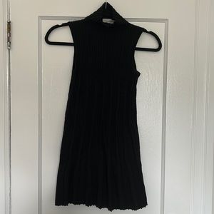 Sleeveless black turtleneck
